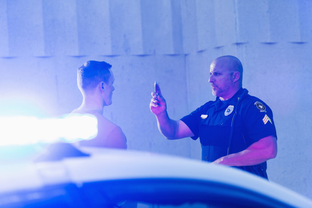 Policeman conducting a field sobriety test before a DUI arrest